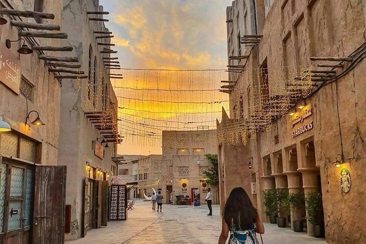 Experience the charm of Dubai's historical districts during a private photo session capturing stunning moments surrounded by unique architecture and a breathtaking sunset backdrop. Memories await!